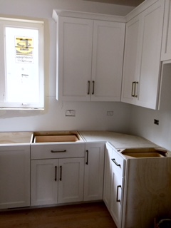 Kitchen cabinet with brass hardware